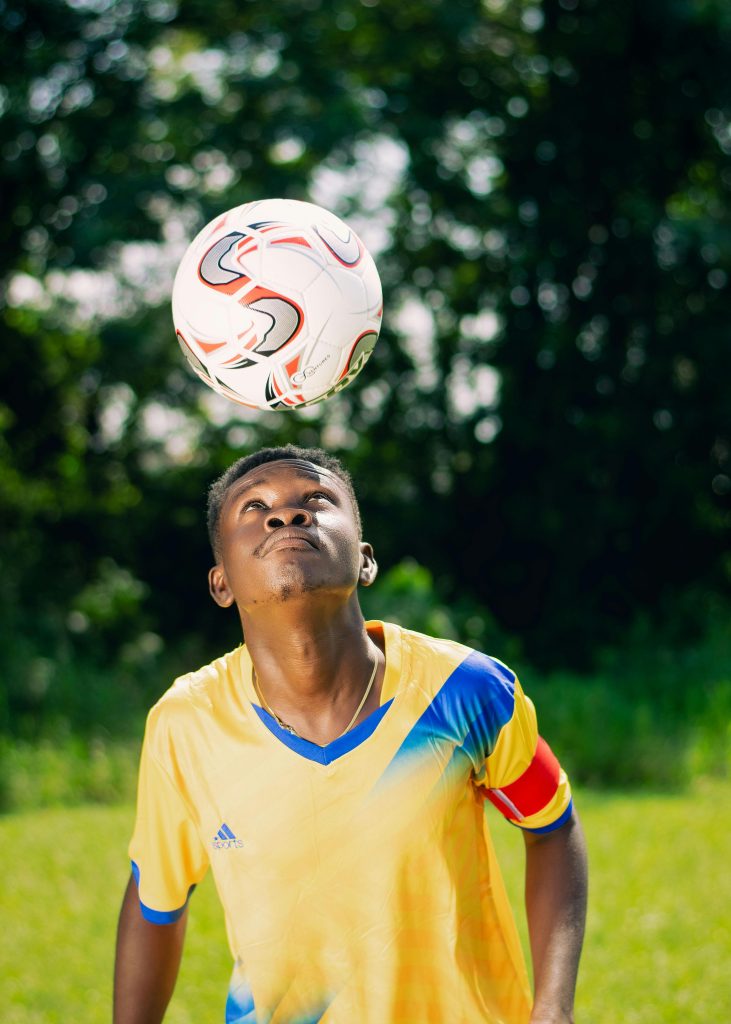 man heading a soccer ball