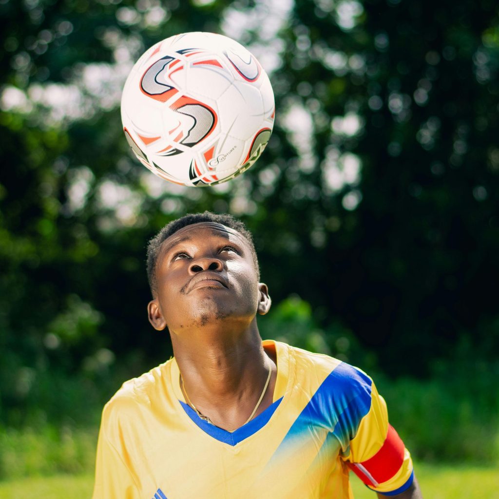 man heading a soccer ball