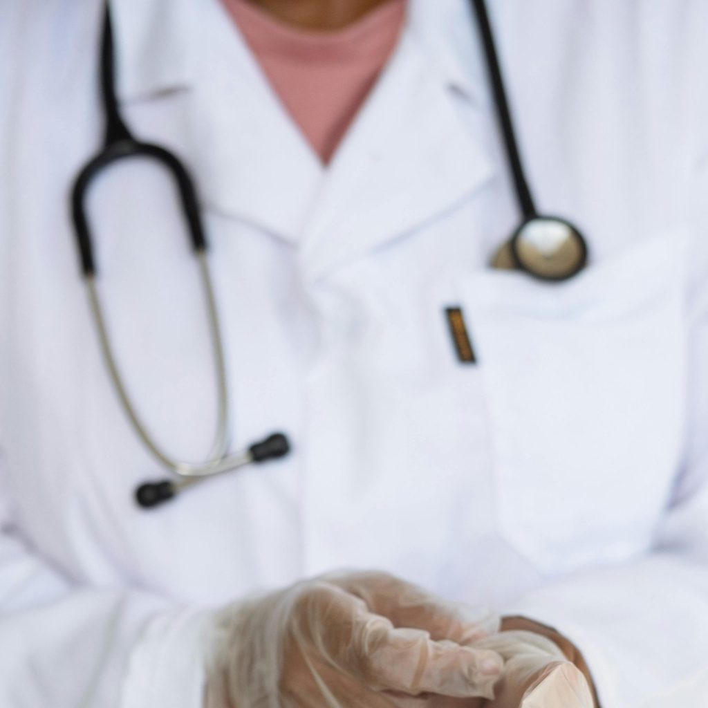 doctor putting on gloves.