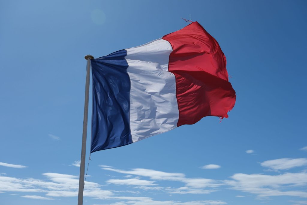 French flag blowing in the wind.
